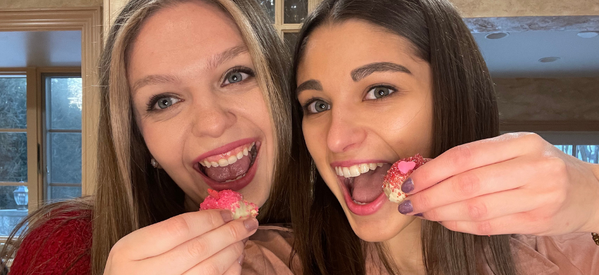 Sarah and Brooke eating their Red Velvet Cake Truffles