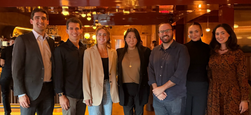 Event attendees smiling for a photo