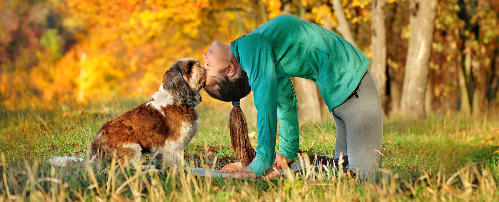 Girl doing yoga with dog