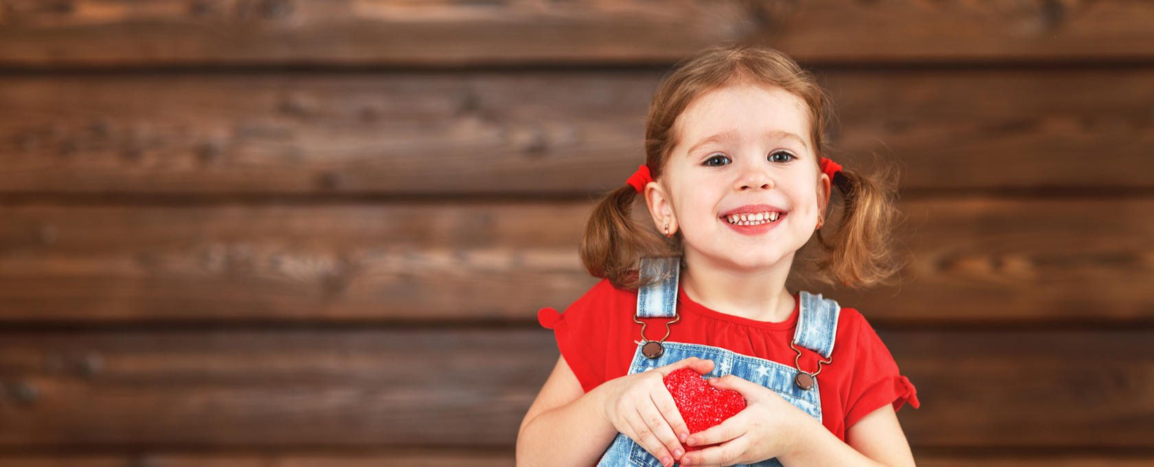 Girl holding a heart for Valentine's Day