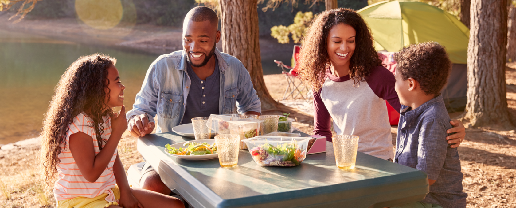 Family eating at a picnic table