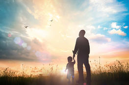 father child field shutterstock_654499312