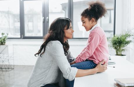 Mother talking to daughter