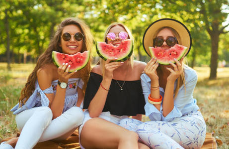 Friends eating watermelon
