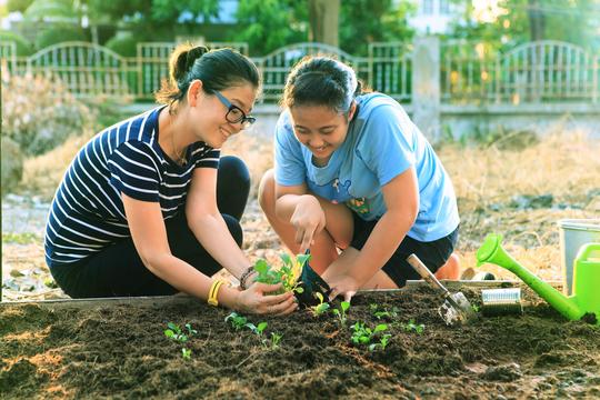 Mom and Daughter gardening