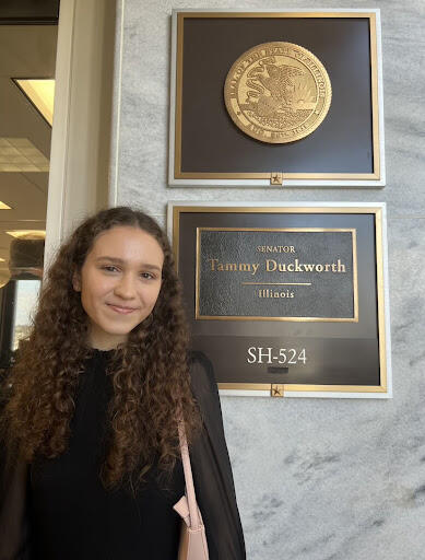 Lizzy Anderlik Courage at Congress 2023 next to Sen Duckworth's nameplate