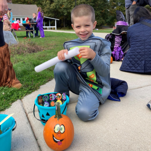 Spaceman kid with his Teal Pumpkin Project goodies