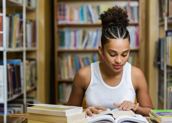 Teen Studying in a Library