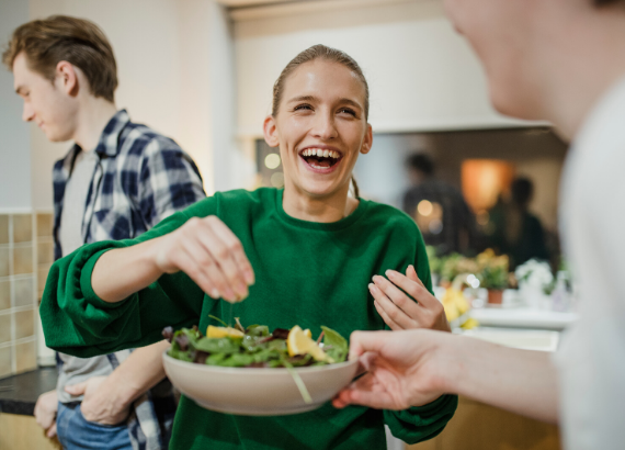 woman holding salad bowl