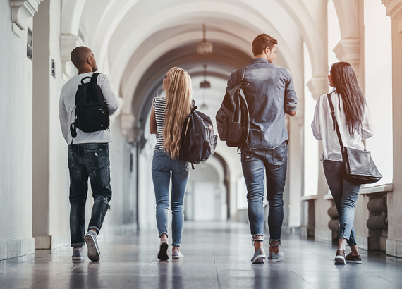 College kids walking down a hall