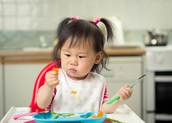 child eating food