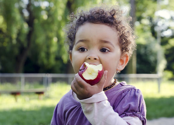 Little boy with an apple