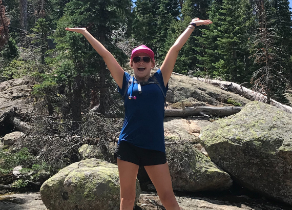 Girl excited on a mountain