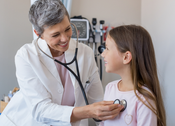 doctor checking kids heartrate