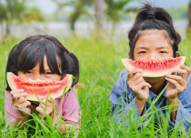 Kids eating watermelon