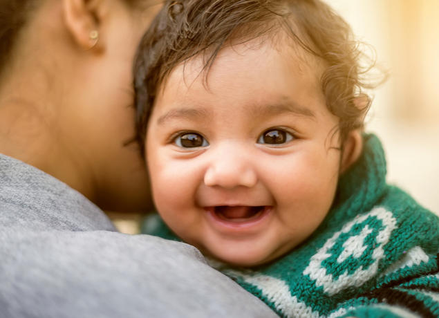 smiling baby with dad