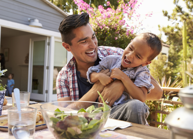 father and son laughing