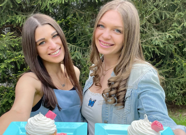 Sarah and Brooke presenting starburst cupcakes on teal plates