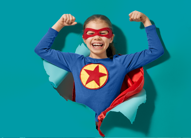 Super girl breaking through teal paper