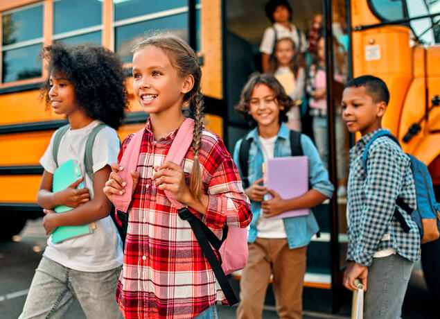 kids getting off a school bus