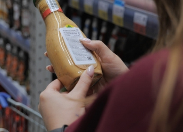 Girl reading a label