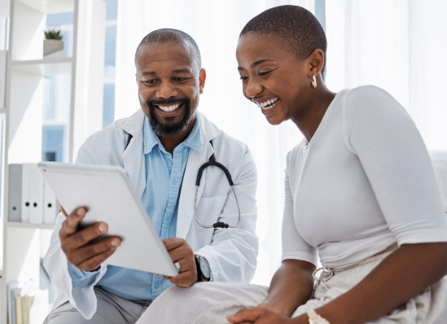 Doctor showing patient a tablet