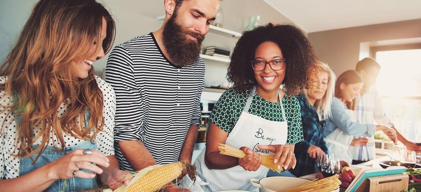 Friends cooking together