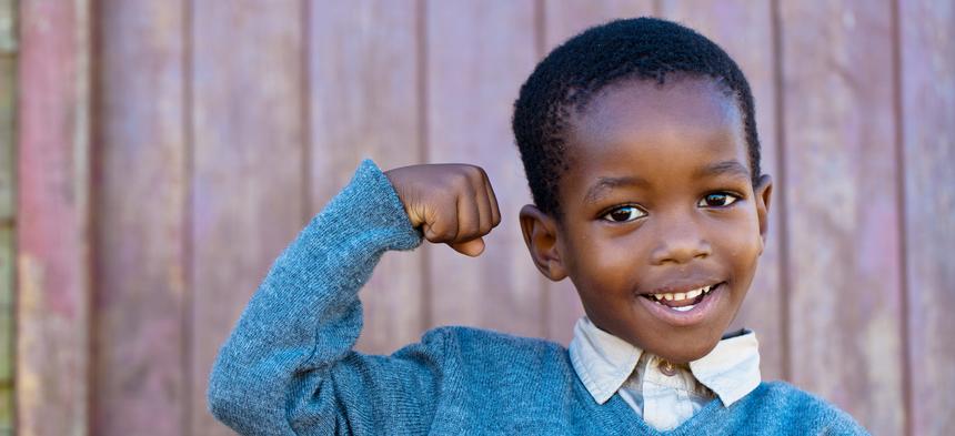 Boy showing muscles