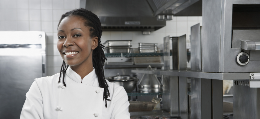 Chef smiling in kitchen